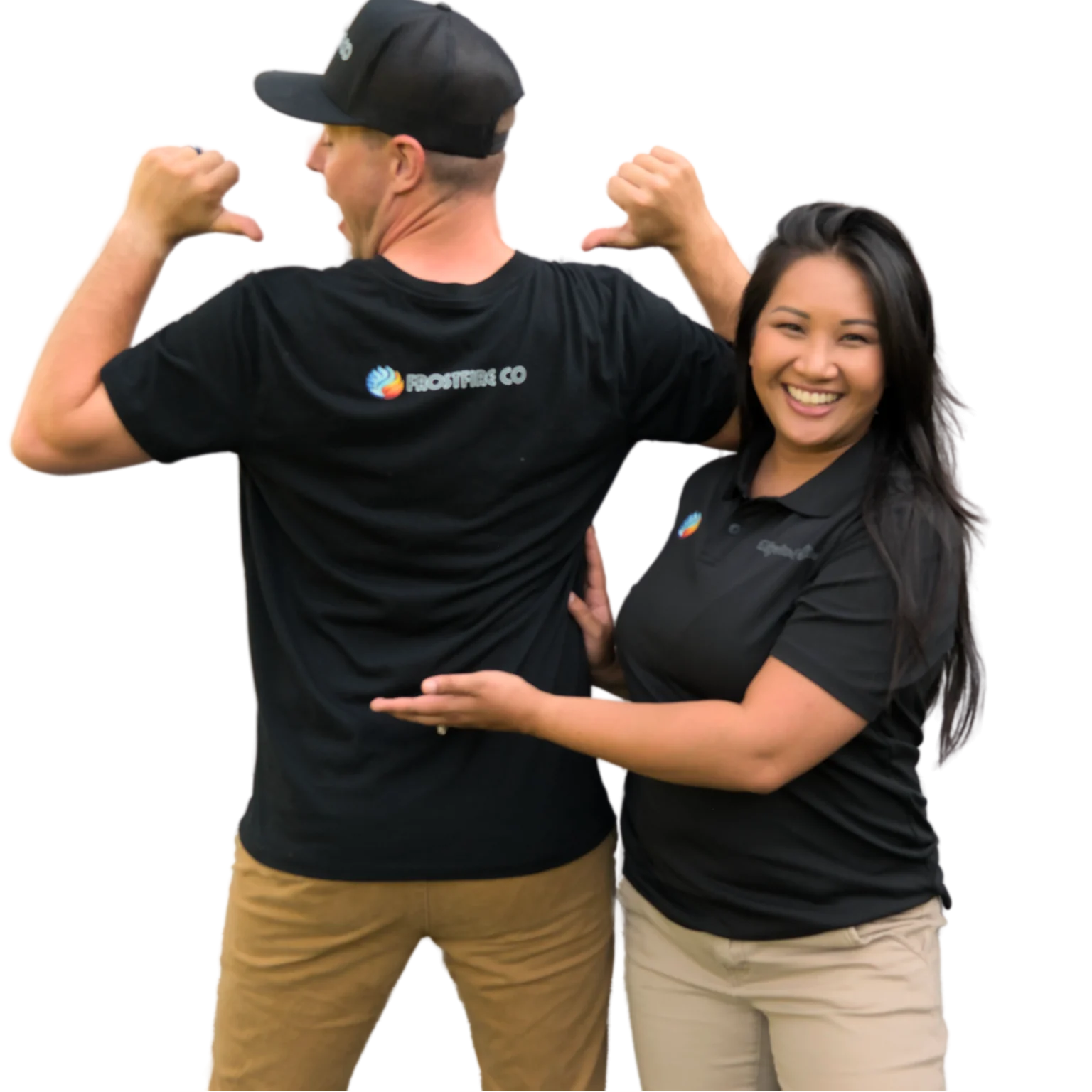 Two smiling team members wearing black Frostfire Co branded shirts, with the man pointing to the logo on his back and the woman gesturing toward it, showcasing company pride and teamwork